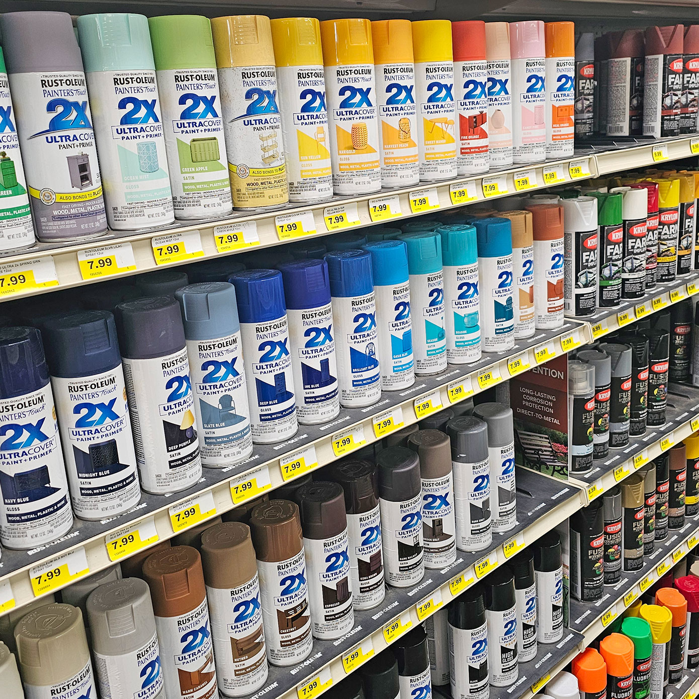 Cans of spray paint on store shelves.